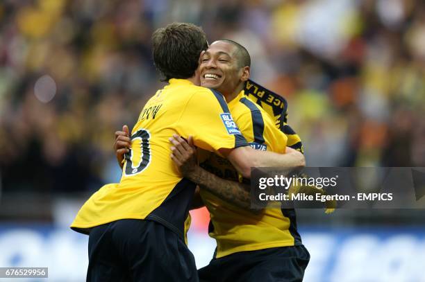 Oxford United's Jack Midson and Damian Batt celebrate after the final whistle