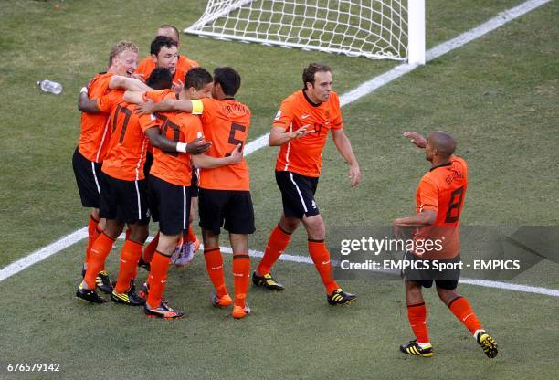 Netherlands' Dirk Kuyt celebrates with his team mates after scoring his sides second goal of the game