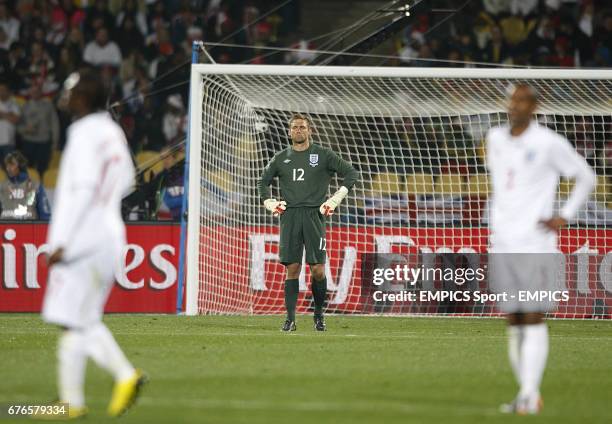 England goalkeeper Robert Green stands dejected