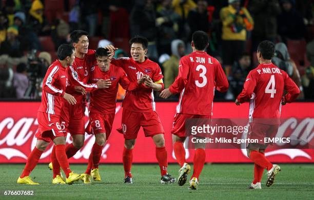 Korea DPR's Ji Yun-Nam celebrates with his team mates after scoring his sides first goal of the game