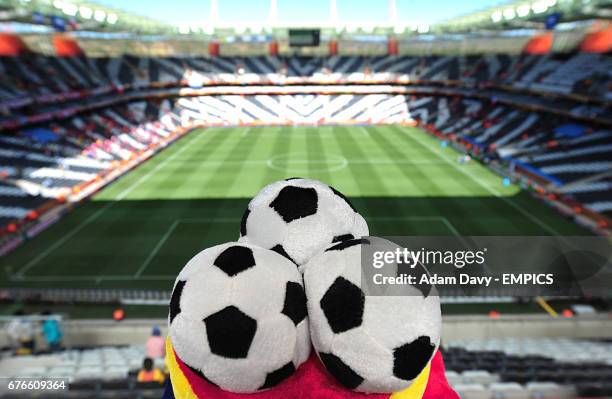 Fan wears a football hat at the Mbombela Stadium