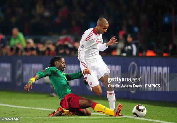 Denmark's Simon Poulsen and Cameroon's Alex Song battle for the ball