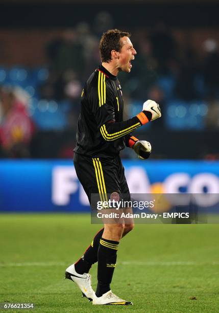 Denmark goalkeeper Thomas Sorensen celebrates victory after the final whistle