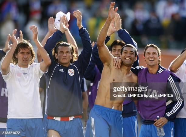 Paraguay players celebrate victory after the final whistle
