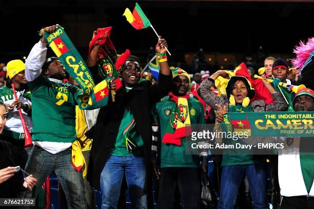 Cameroon fans cheer on their side in the stands