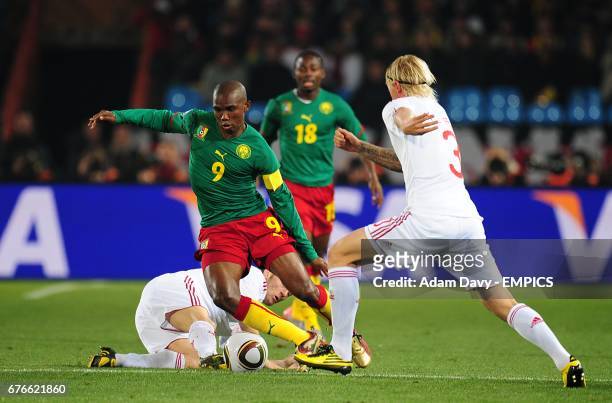 Denmark's Simon Kjaer and Cameroon's Samuel Eto'o battle for the ball