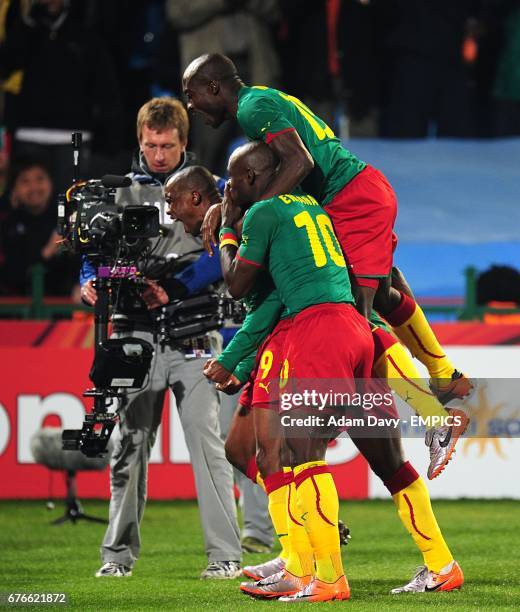 Cameroon's Samuel Eto'o celebrates scoring his sides first goal of the game with teammates