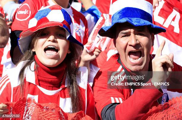 Paraguay fans cheer on their side in the stands