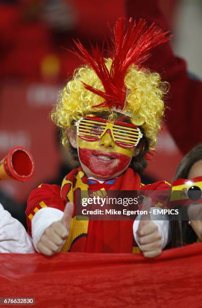 Spain fan gives the thumbs up in the stands