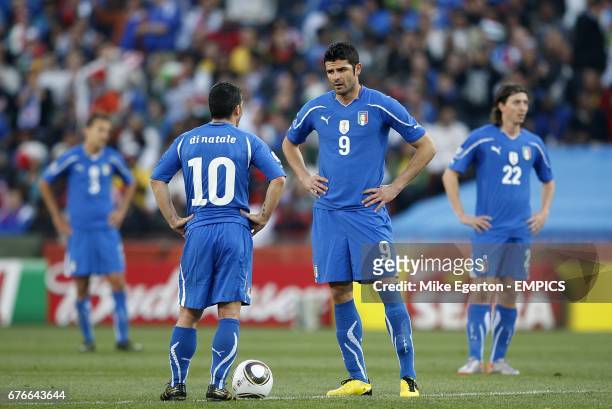 Italy's Antonio Di Natale and Vincenzo Iaquinta stand dejected on the center spot after Slovakia score