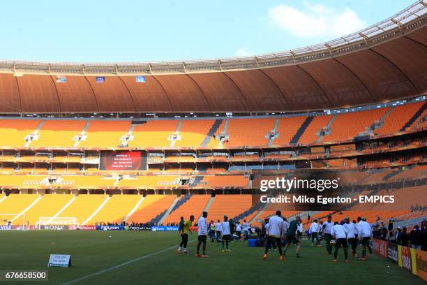 The South Africa team train on the pitch at Soccer City stadium, Johannesburg, the day before the opening ceremony