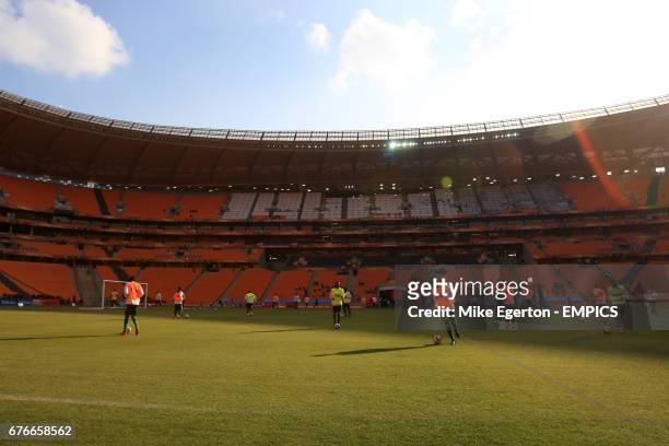 The South Africa team train on the pitch at Soccer City stadium, Johannesburg, the day before the opening ceremony