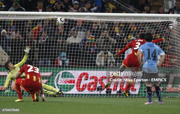 Ghana's Asamoah Gyan misses his penalty at the end of extra time
