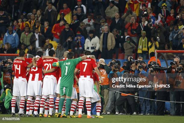 Crowd of photographers take photos of Paraguay's startin line up.