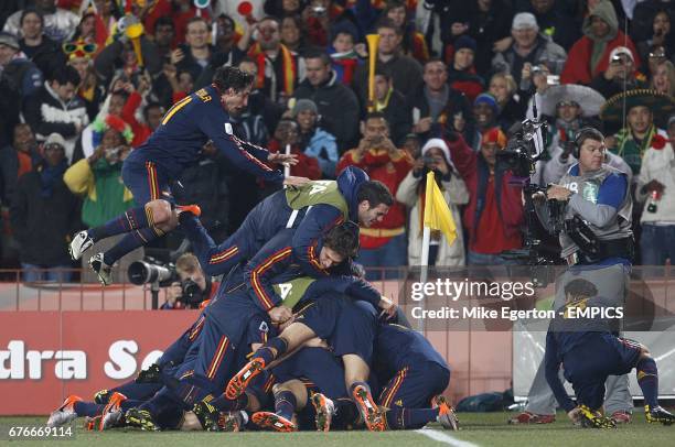 Spain's David Villa celebrates with his team mates after scoring the opening goal.