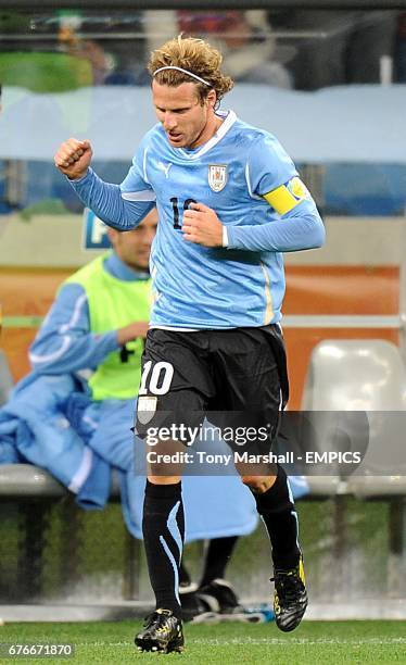 Uruguay's Diego Forlan celebrates scoring his sides goal of the game