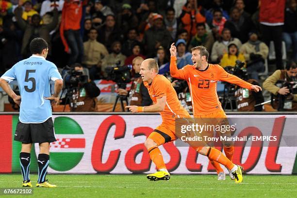 Netherlands' Arjen Robben celebrates scoring his sides third goal of the game