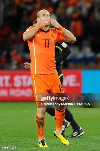 Netherlands' Arjen Robben celebrates scoring his sides third goal of the game