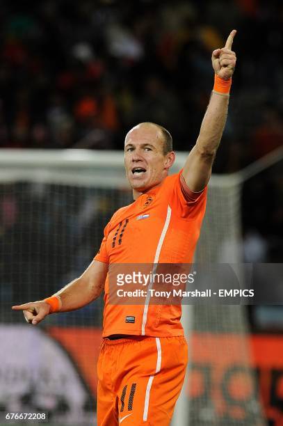 Netherlands' Arjen Robben celebrates scoring his sides third goal of the game