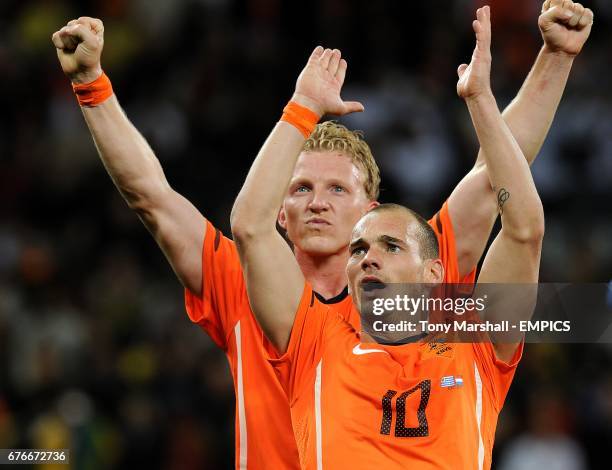 Netherlands' Dirk Kuyt and Wesley Sneijder celebrates after the final whistle