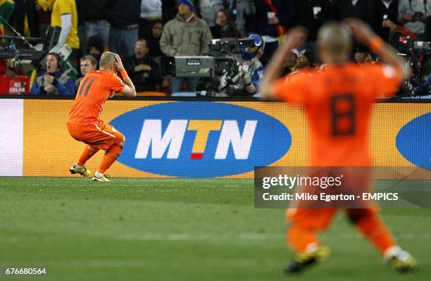 Netherlands' Arjen Robben and Nigel De Jong dejected after a missed chance on goal
