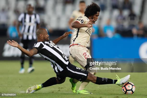 Airton of Botafogo struggles for the ball with Christian Aleman of Barcelona de Guayaquil during a match between Botafogo and Barcelona de Guayaquil...
