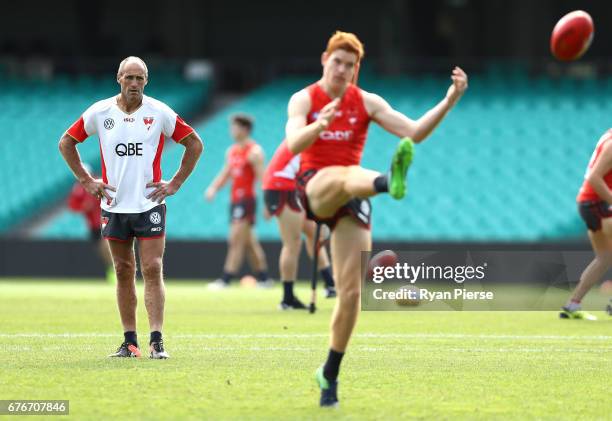Legend and Sydney Swans Goalkicking coach Tony Lockett looks on as Toby Pink of the Swans trains during a Sydney Swans AFL training session at Sydney...
