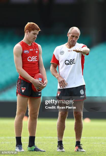 Legend and Sydney Swans Goalkicking coach Tony Lockett speaks to Toby Pink of the Swans during a Sydney Swans AFL training session at Sydney Cricket...