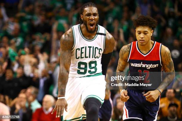 Jae Crowder of the Boston Celtics celebrates next to Kelly Oubre Jr. #12 of the Washington Wizards during the second quarter of Game Two of the...