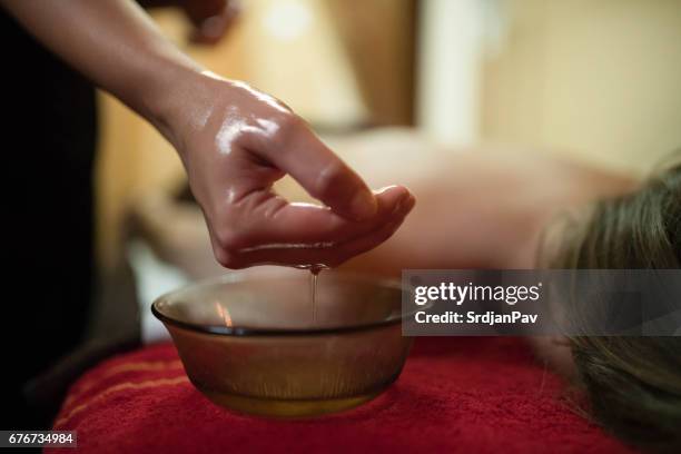 revitalizing oil - ayurveda stock pictures, royalty-free photos & images