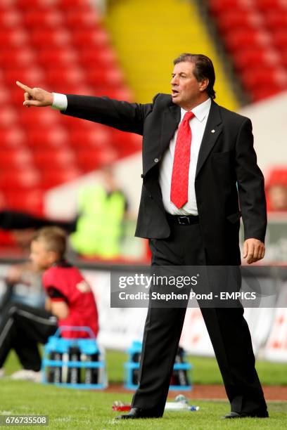 Estudiantes assistant coach Guillermo Trama gestures on the touchline