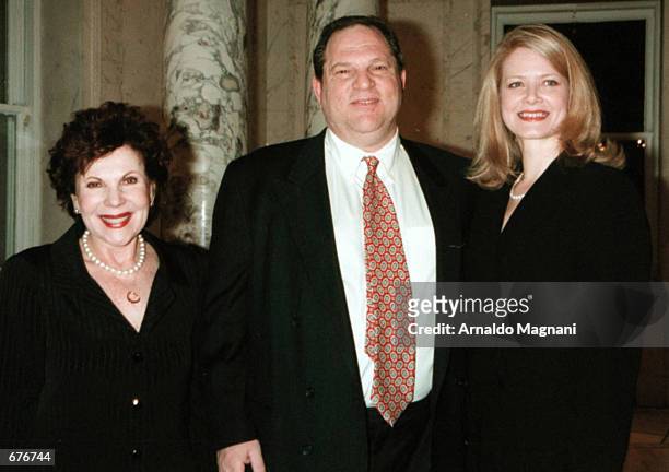 Producer Harvey Weinstein poses with Miriam Weinstein, left, and his wife Eve January 15, 2001 at the French Embassy where he received an award, the...