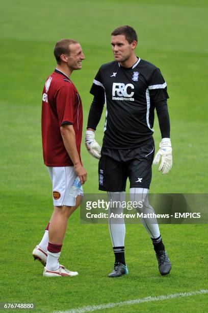 Birmingham City's goalkeeper Ben Foster has a chat with his former team mate at Wrexham, Northampton Town captain Andy Holt