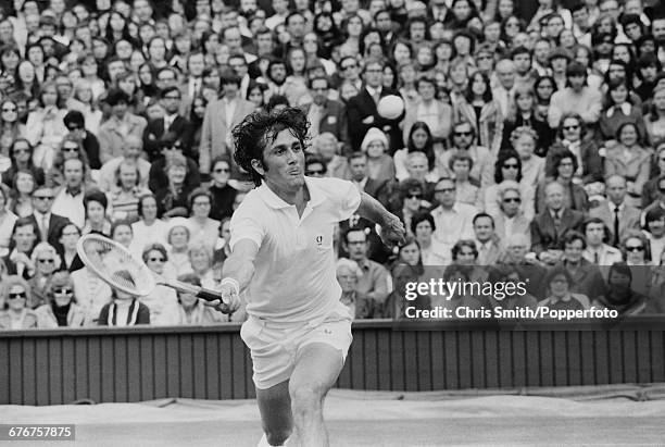 Romanian tennis player Ilie Nastase pictured in action during competition to win his fourth round match against American tennis player Tom Gorman...