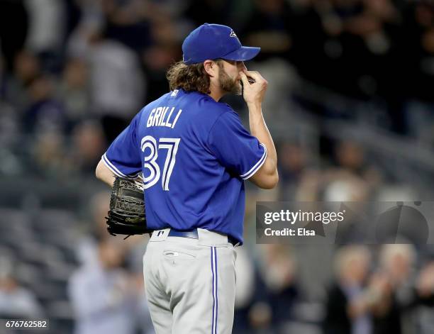Jason Grilli of the Toronto Blue Jays reacts after giving up a three run home run to Aaron Judge of the New York Yankees in the seventh inning on May...
