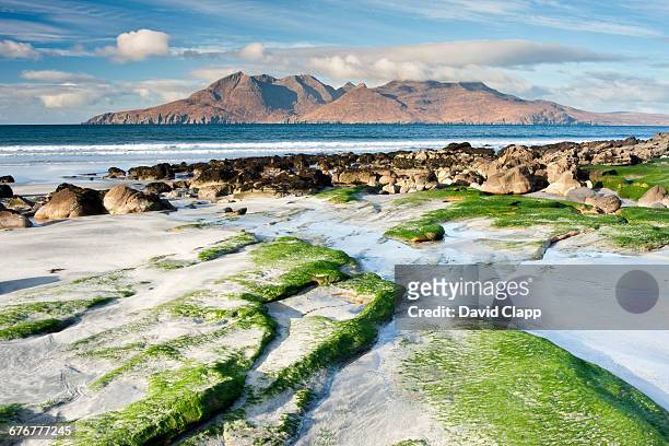 the isle of rum from laig bay, eigg - rocky coastline stock pictures, royalty-free photos & images
