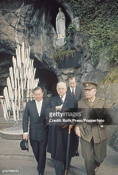 President of Ireland, Eamon de Valera pictured in centre as he visits the statue of Our Lady of Lourdes shrine during a pilgrimage to the town of...