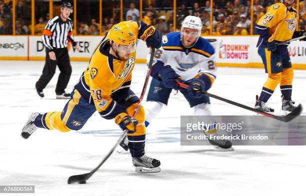 Paul Stastny of the St. Louis Blues watches as Viktor Arvidsson of the Nashville Predators fires a shot during the first period of Game Four of the...