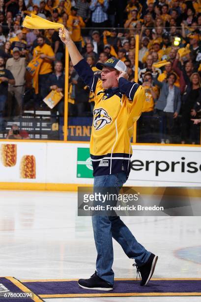 Golfer Brandt Snedeker waves a rally towel prior to Game Four of the Western Conference Second Round between the Nashville Predators and the St....