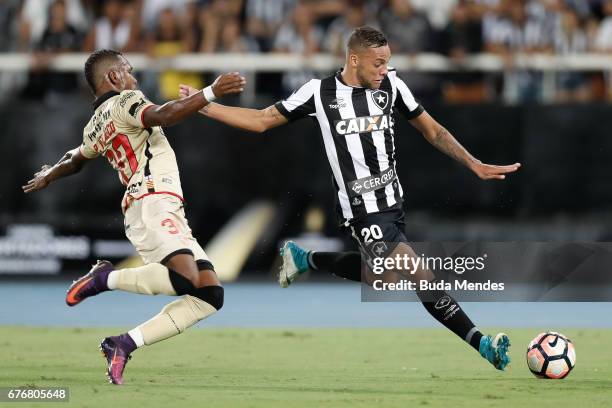 Guilherme of Botafogo struggles for the ball with Pedro Velasco of Barcelona de Guayaquil during a match between Botafogo and Barcelona de Guayaquil...