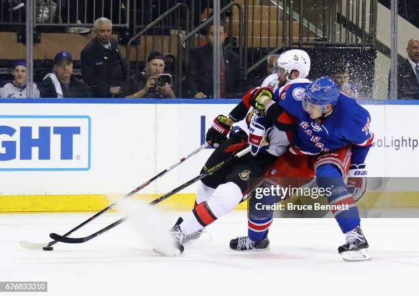 Brady Skjei of the New York Rangers takes a penalty for holding Viktor Stalberg of the Ottawa Senators in Game Three of the Eastern Conference Second...