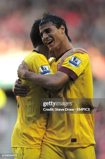 Arsenal's Francesc Fabregas celebrates scoring their first goal of the game with team-mate Marouane Chamakh