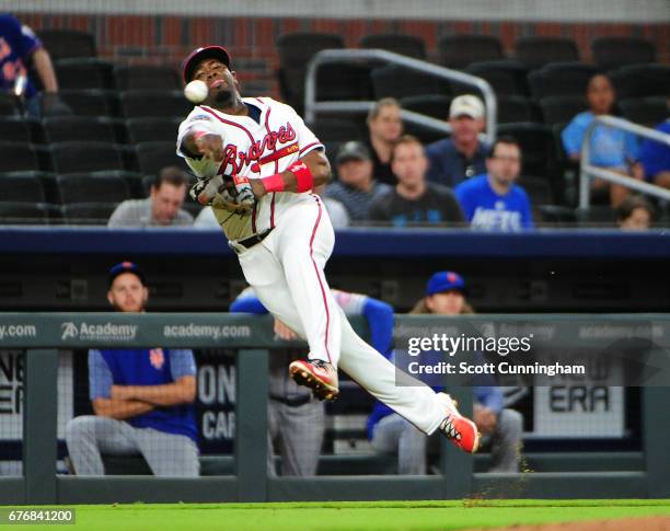 Adonis Garcia of the Atlanta Braves attempts to throw out a ninth inning runner against the New York Mets at SunTrust Park on May 2, 2017 in Atlanta,...