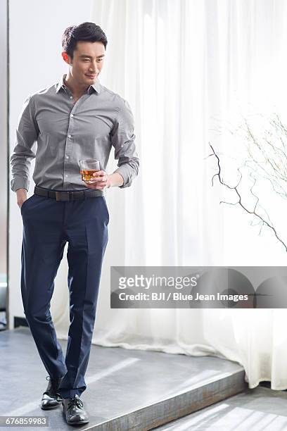 young man enjoying fine wine - open collar stock pictures, royalty-free photos & images