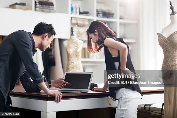 fashion designers working in studio - short sleeve work shirt stock pictures, royalty-free photos & images