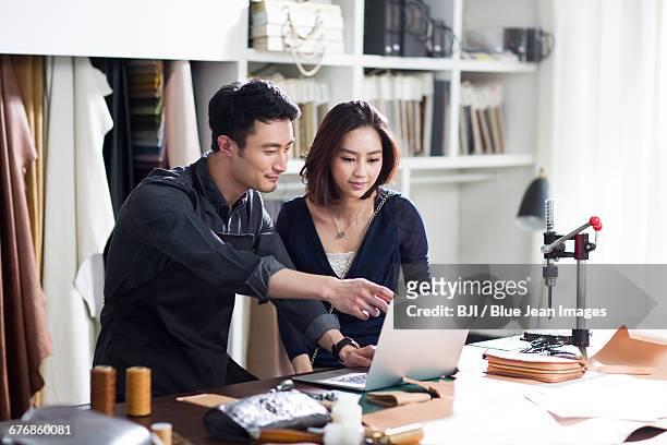 craftsman and customer talking in studio - design studio woman chinese laptop bildbanksfoton och bilder