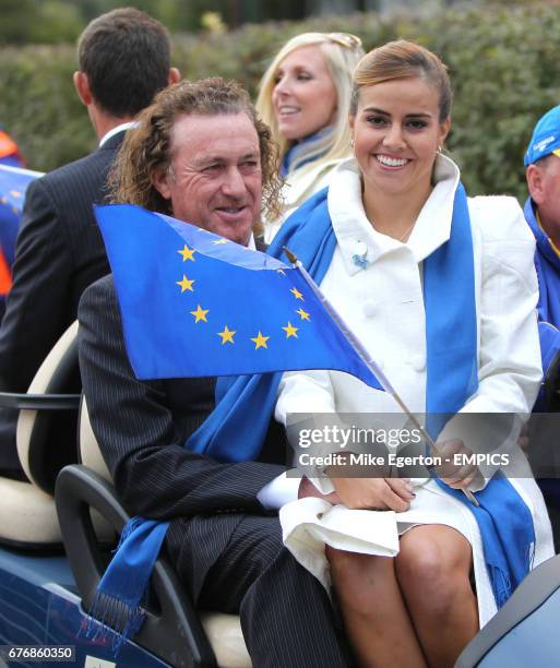 Europe's Miguel Angel Jimenez wife his wife Marian are driven away from the opening ceremony