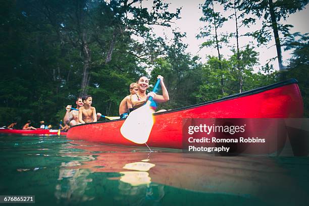family on a canoe trip together at econfina spring, florida, usa - family red canoe stock pictures, royalty-free photos & images