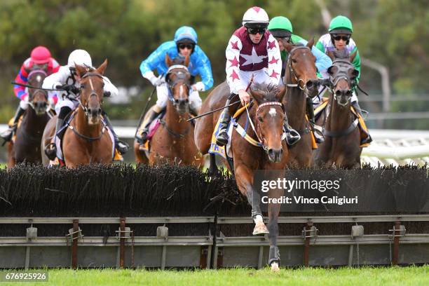 John Allen riding Renew jumps the last hurdle before winning Race 6, Galleywood Hurdle during the Warrnambool Racing Carnival on May 3, 2017 in...