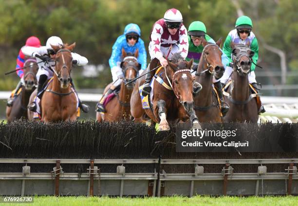 John Allen riding Renew jumps the last hurdle before winning Race 6, Galleywood Hurdle during the Warrnambool Racing Carnival on May 3, 2017 in...